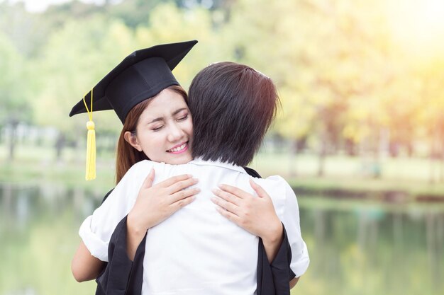 Close-up of women embracing friend while standing outdoors