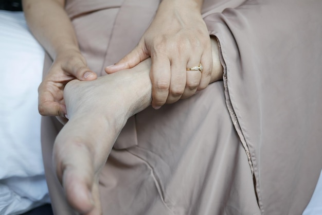 Close up on women feet and hand massage on injury spot