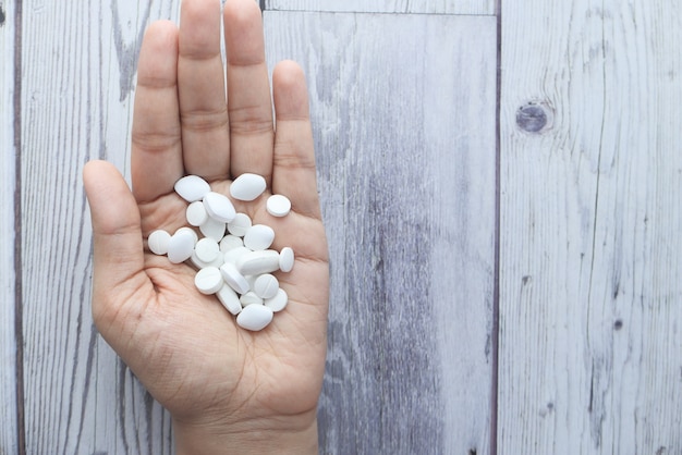 Close up of women hand taking pills