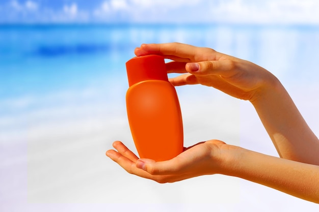 Close up of women hands receiving sunblock cream lotio