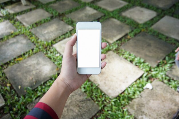 Close up of women's hands holding cell telephone blank copy space screen. smart phone with technology concept.