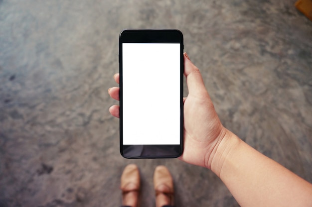 Close up of women's hands holding cell telephone