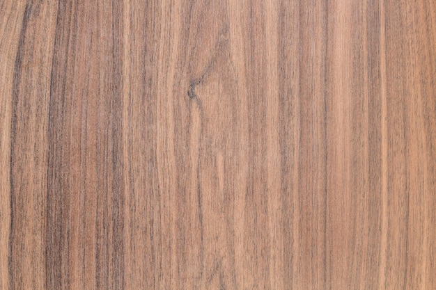 A close up of a wood panel with a dark stain