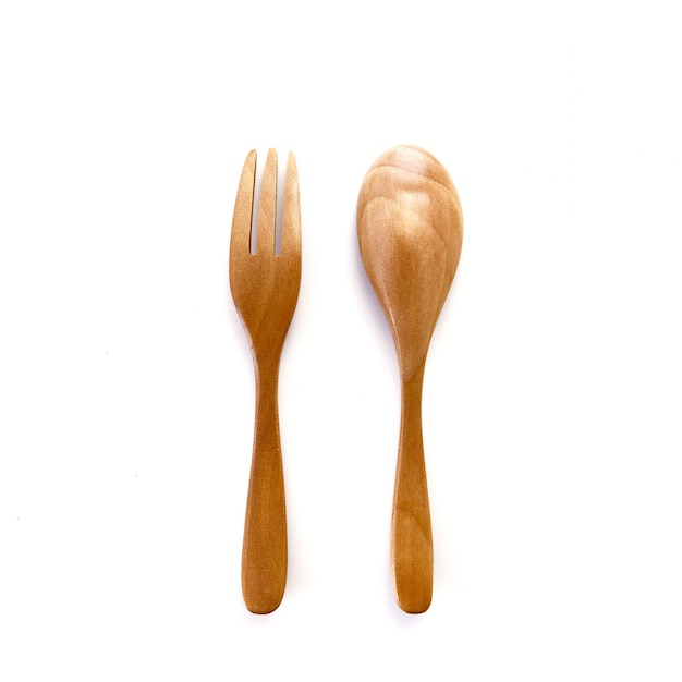 Close up a wooden fork and spoon isolated on white background