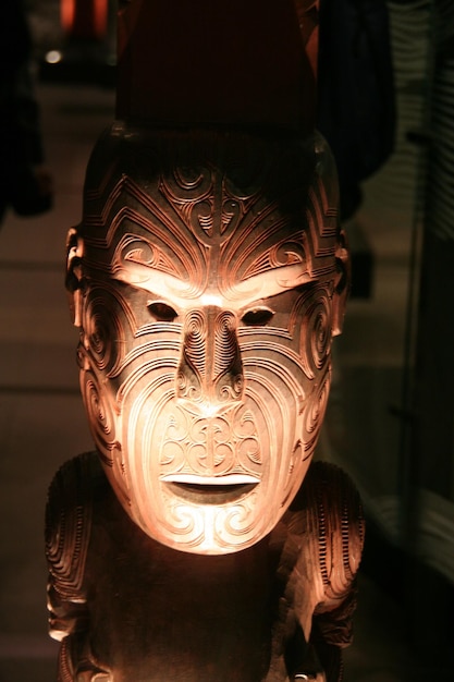 close-up of wooden mask in darkroom
