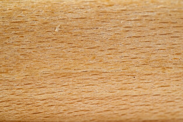 A close up of a wooden piece of wood with a yellow texture.