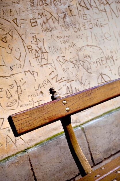 Close up of a wooden seat in the street