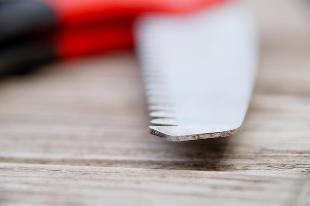 Close-up of work tool on wooden table