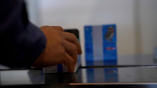 Close up of worker hands finishing the packing of a small cardboard box media details of post office