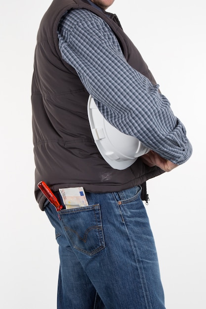 Close-up worker holding helmet and tools on his belt isolated