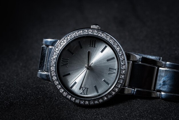 Close-up of wristwatch on black background