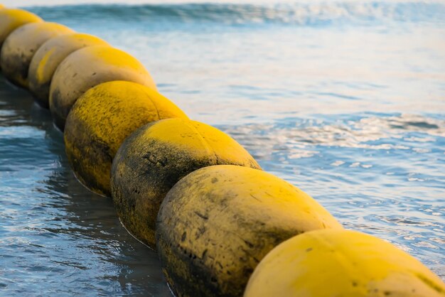 Close-up of yellow ball on beach