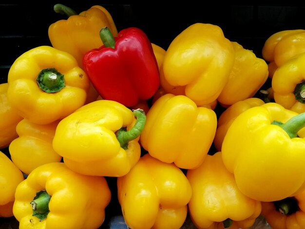 Close-up of yellow bell peppers for sale in market