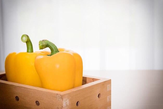 Close-up of yellow bell peppers on table