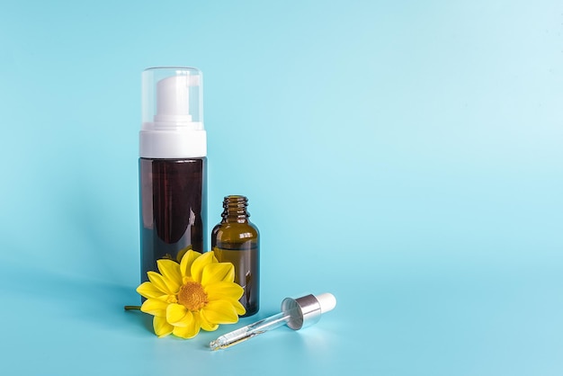 Photo close-up of yellow bottle against blue background