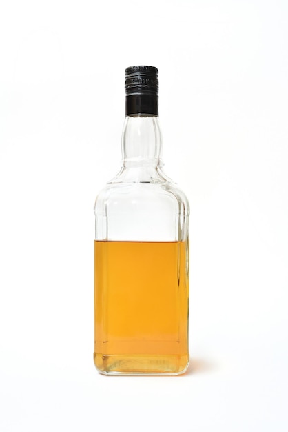 Photo close-up of yellow bottle against white background