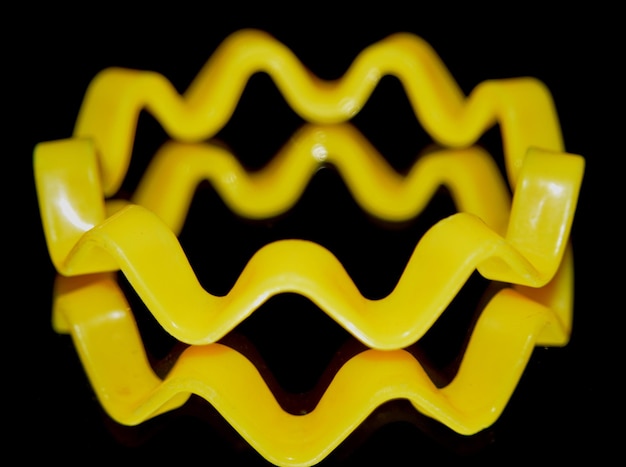 Photo close-up of yellow bracelet on mirror