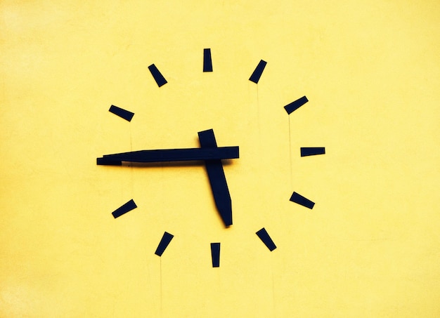 close-up of yellow clock