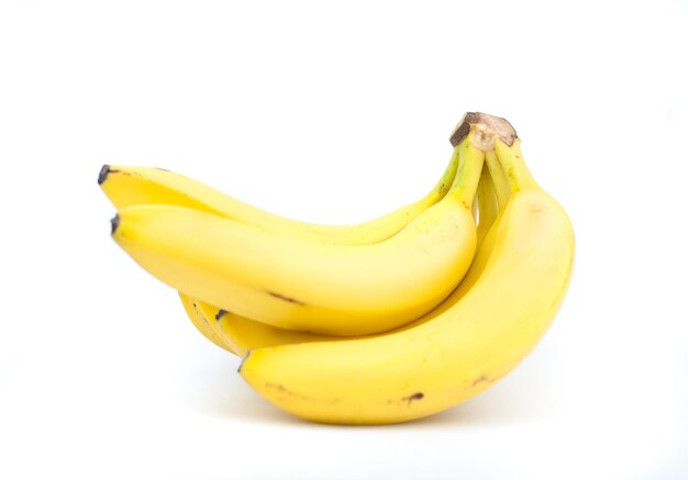 Photo close-up of yellow fruit against white background