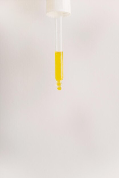 Close-up of yellow light over white background