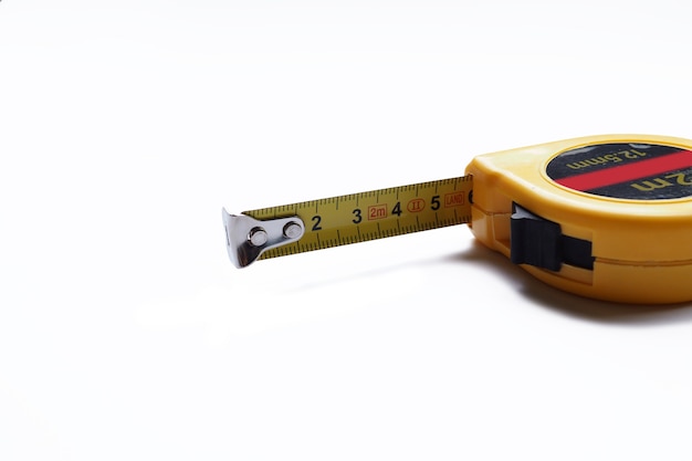 Photo close up on yellow measure tape isolated