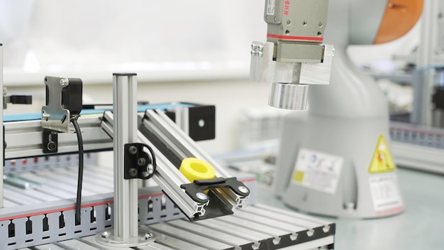 close up of yellow object created by d printer in modern workshop scene technological background of
