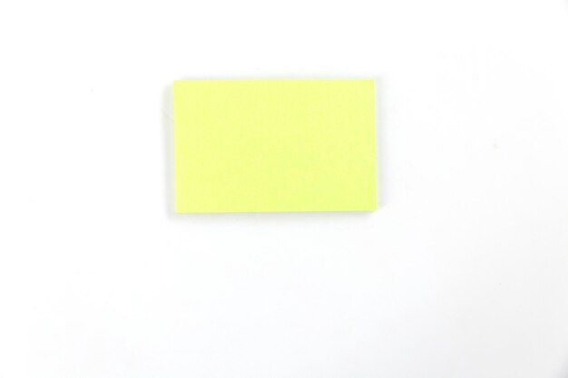 Close-up of yellow paper over white background