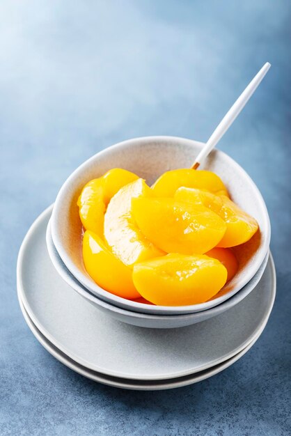 Close-up of yellow slices in bowl on table