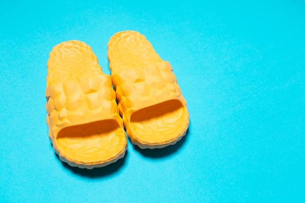 Close-up of yellow slippers  background.