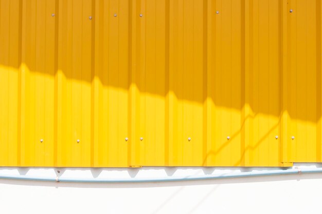 Photo close-up of yellow wall in building