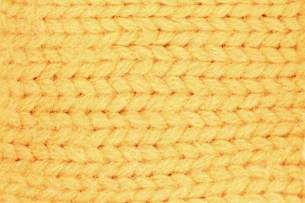 Close up on yellow wool knitted texture