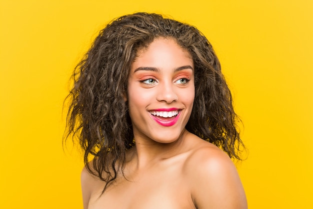 Close up of a young african american beautiful and make-up woman posing