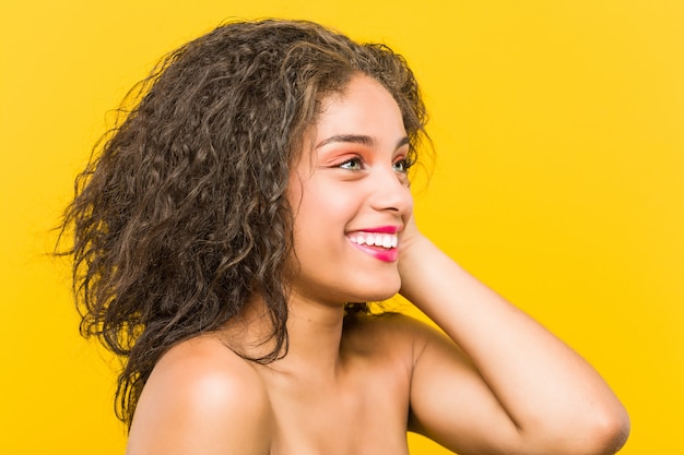 Close up of a young african american beautiful and make-up woman posing