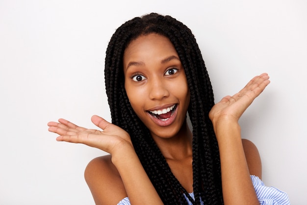 Close up young african woman looking surprised on white background