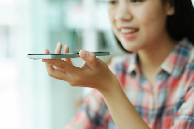 Close up young asian woman using mobile phone