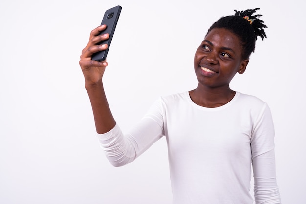 Close up of young beautiful African woman isolated