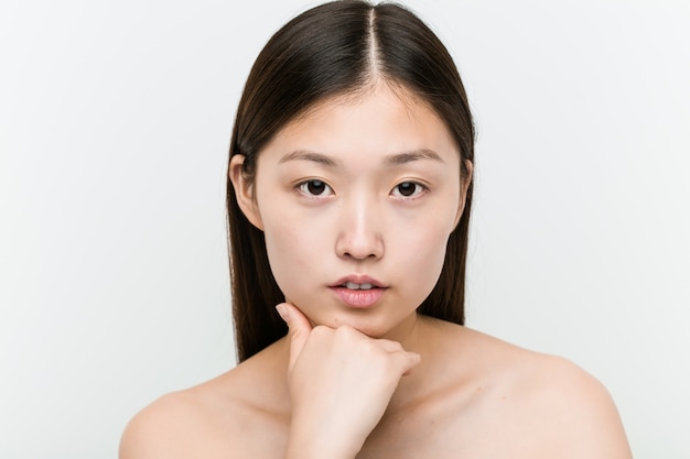 Close up of a young beautiful and natural asian woman