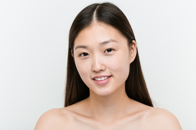 Close up of a young beautiful and natural asian woman