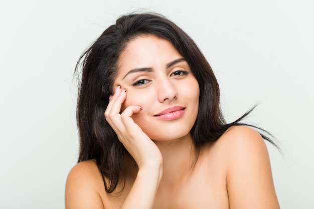 Close up of a young beautiful and natural hispanic woman