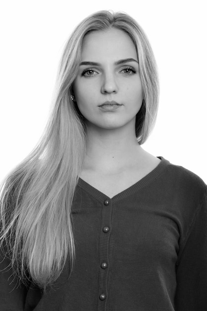 Close up of young beautiful teenage woman with blond hair isolated