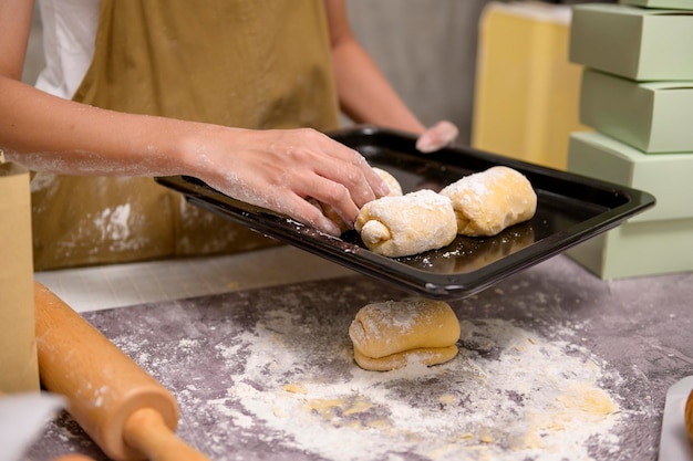 Close up of Young beautiful woman is baking in her kitchen bakery and coffee shop business