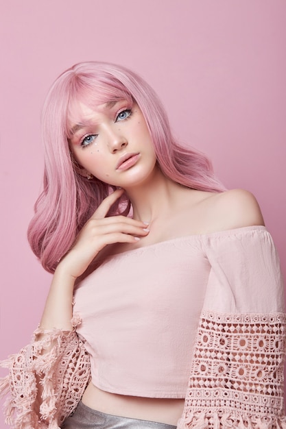 Close up on young beautiful woman with pink hair