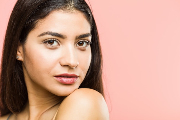 Close up of a young beauty and natural woman posing