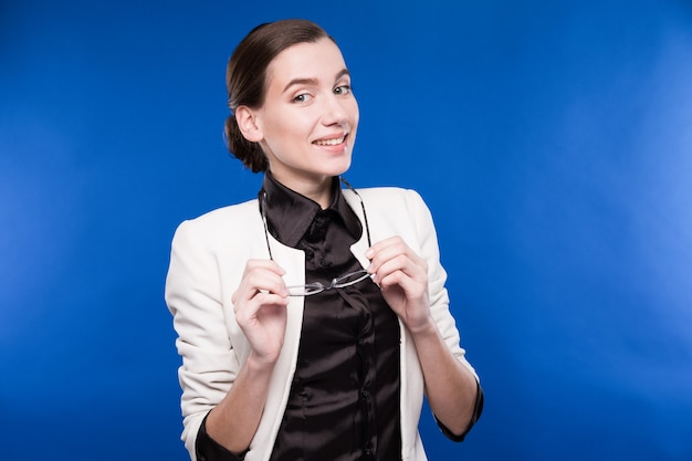 Close-up of a young brunette in a jacket and blouse