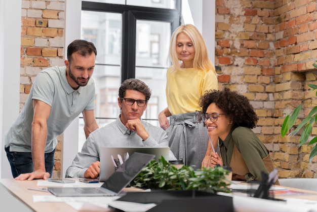 Photo close up on young business team working