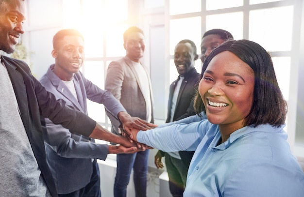 Close up. young business woman and her colleagues are showing their unity .