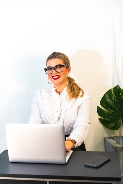 Close up of a young businesswoman working on the laptop