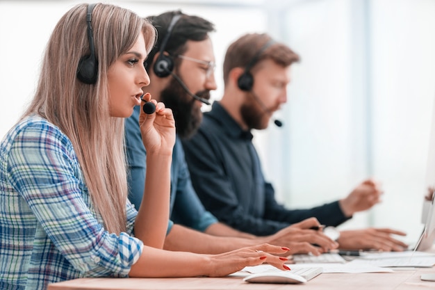 Close up. young call center employee in the workplace.