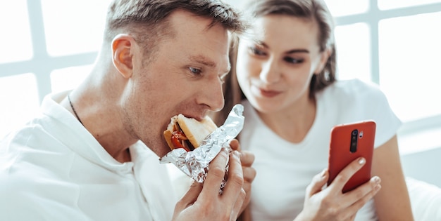 Close up. young couple is discussing something sitting on the sofa. lifestyle.