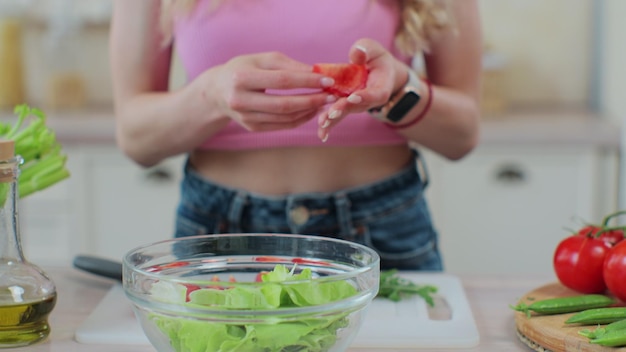 Close up young girl in the process of preparing healthy food Healthy eating and cooking concept